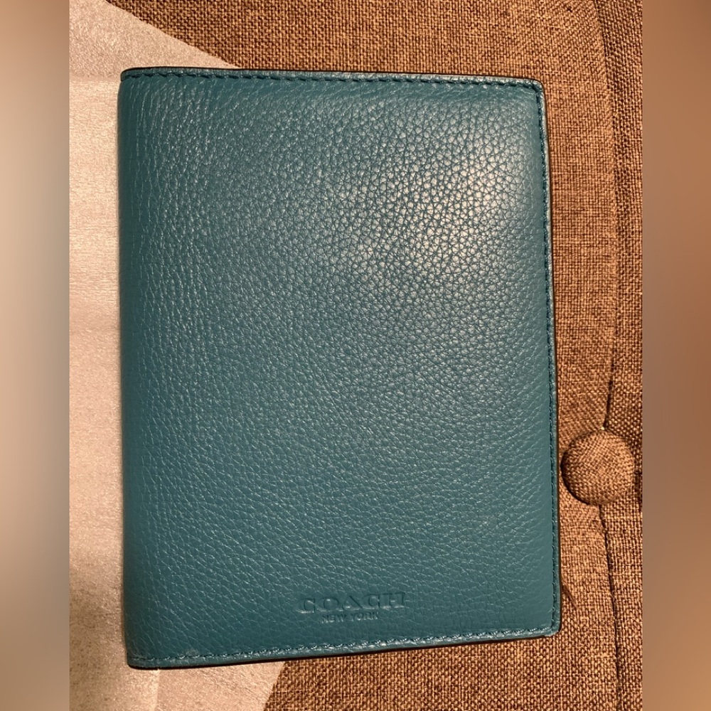 Like new Coach passport wallet.
